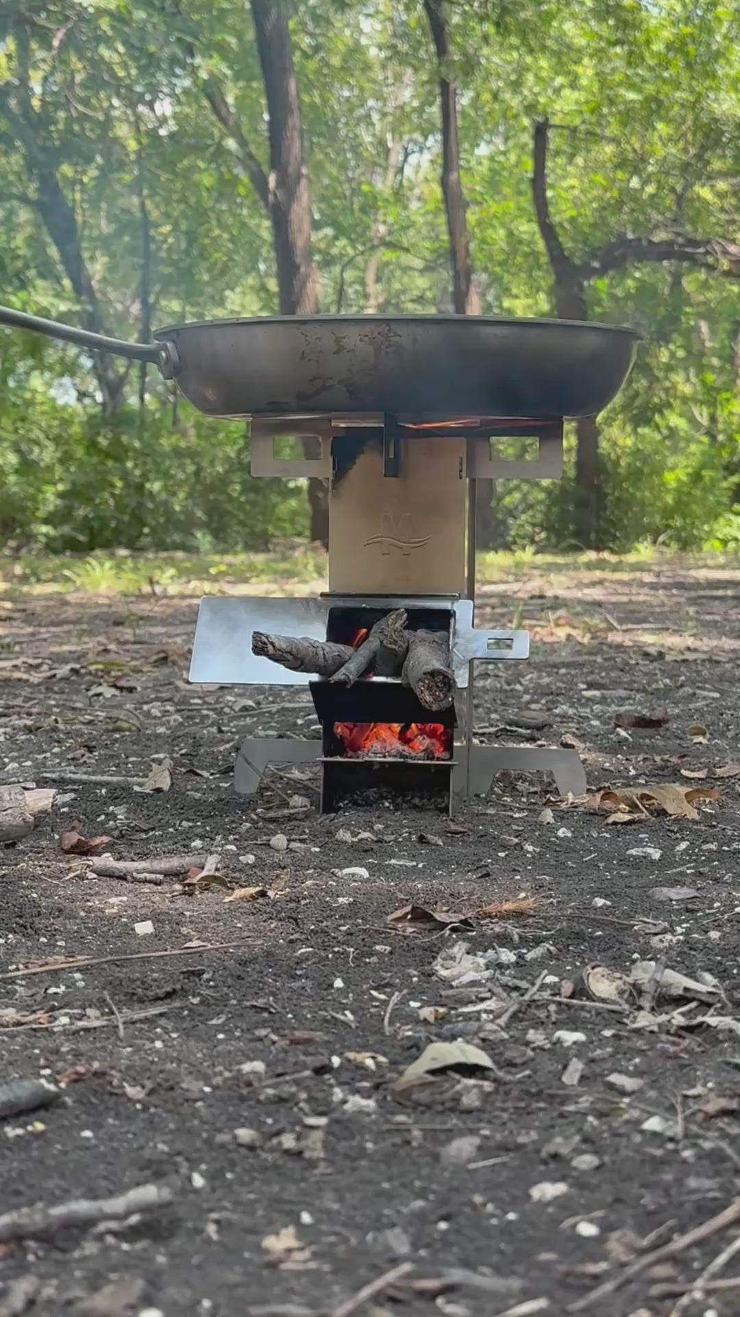 Video of portable rocket stove burning fuel and cooking food